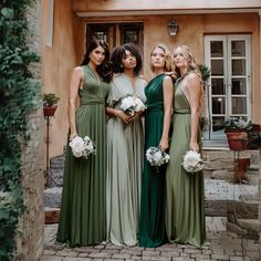 the bridesmaids are all dressed in different styles and colors, posing for a photo