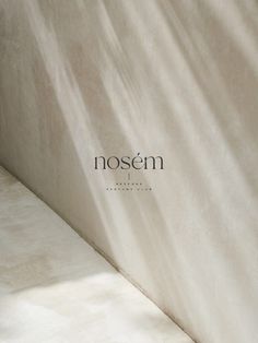 a white bench with the word nosem written on it