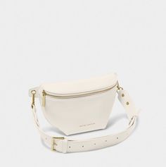 Our Maya Belt Bag in off white is here to accompany you on every summer adventure. With a captivating selection of three warm-weather ready colorways, this vegan leather gem effortlessly blends fashion with functionality. The adjustable wide strap guarantees a comfortable fit, while the internal pocket ensures effortless organization of small essentials. The gold-tone zip fastening not only adds a touch of elegance but also secures belongings, allowing for carefree dancing at festivals and beyon Icon Jewelry, Icon Clothing, Easter Pillows, Local Gifts, Faith Gifts, Summer Adventures, Wide Straps, Christmas Shopping, Belt Bag