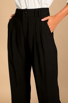 Lulus Exclusive! Per our last email, the Lulus Strictly Business Black High Waisted Trouser Pants are highly recommended for all boss babes! Lightweight woven fabric creates a high waist (with a bit of elastic at the back), belt loops, and a brown marbled top button with a hidden zip fly. Pleated accents detail relaxed pant legs, with two diagonal pockets, that taper to ankle-length hems. Twin patch pockets at back. Pair with the matching blazer for a complete look! Fit: This garment fits true t Chic Bottoms With Elastic Waistband For Work, Trendy Business Casual High-waisted Pants, Trendy High Waist Wide Leg Pants For Date Night, Chic Bottoms With Elastic Waistband For Date Night, Chic Solid Pants For Date Night, Solid High Waist Business Casual Bottoms, High Waist Bottoms For Business Casual, Trendy Business Casual Bottoms With Elastic Waistband, High Waist Solid Bottoms For Business Casual