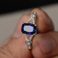 This is a gorgeous handmade creation. Its beauty is its simplicity & Elegance. The 6*8mm cushion cut lab sapphire is crafted in sterling silver with rhodium plated. It's made to order and it will take about 7-10 days to make it. All item is sent in a beautiful gift box You can realize more lovely stuff clicking the link https://www.etsy.com/shop/knightjewelry?refshopsection_shophome_leftnav Please leave the correct address and you phone number for delivering successfully. Silver Sapphire Ring With Cushion Cut, Sapphire Cushion Cut Cubic Zirconia Ring, Blue Radiant Cut Sapphire Ring In Sterling Silver, Sapphire Square Cut Gemstone Ring, Lab-created Sapphire Ring With Square Cut Gemstone, Square Cut Lab-created Sapphire Gemstone Ring, Sapphire Ring With Square Diamond Cut, Gift Sapphire Ring With Cushion Diamond Cut, Gift Cushion Cut Sapphire Ring With Diamond Detailing