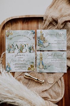 a baby shower is set up on a wooden tray next to a fur rug and bottle opener