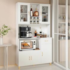 a microwave oven sitting on top of a white cabinet