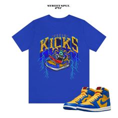 Fresh Kicks Monster T Shirt to Match 1 Reverse Laney High Varsity Maize Game Royal UCLA Dunk This classic unisex jersey short sleeve tee fits like a well-loved favorite. Soft cotton and quality print make users fall in love with it over and over again. These t-shirts have-ribbed knit collars to bolster shaping. The shoulders have taping for better fit over time. Dual side seams hold the garment's shape for longer.  .: 100% Airlume combed and ringspun cotton (fiber content may vary for different Blue Throwback Sports T-shirt, Blue Throwback T-shirt For Sports, Urban Short Sleeve T-shirt For Sports Events, Urban Style Short Sleeve T-shirt For Sports Events, Urban Style Athletic Short Sleeve Tops, Yellow Team Spirit T-shirt With Graphic Print, Throwback Short Sleeve Pre-shrunk T-shirt, Short Sleeve T-shirt With Team Logo, Throwback Short Sleeve Tops For Sports