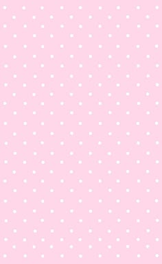 a pink background with white polka dots