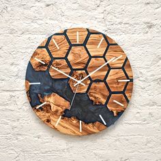 a clock made out of wood with white hands