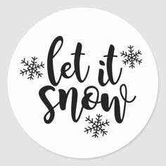 the let it snow sticker is shown in black on a white background with snowflakes