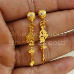 Elevate your style with these beautifully handcrafted gold earrings. Featuring a classic design and a comfortable fit, they add a refined touch to any look. Ideal for everyday wear or special occasions, they bring a subtle yet sophisticated sparkle. 18K Gold Dangle Earrings Metal is Real Gold Purity is 18kt Weight is 2.74 grams approx Max Length is 4.4 cm approx Max width is 0.7 cm approx ,  these earrings comes with normal backs, if you want real gold screw please contact. Please feel free to a Traditional 14k Gold Drop Earrings, Classic 22k Gold Earrings, Classic 22k Gold Hallmarked Earrings, Classic Hallmarked 22k Gold Earrings, 22k Yellow Gold Earrings For Anniversary, Classic 22k Gold Earrings For Formal Occasions, Simple Design 14k Gold Earrings, Elegant Hallmarked Yellow Gold Danglers, Elegant Yellow Gold Hallmarked Danglers