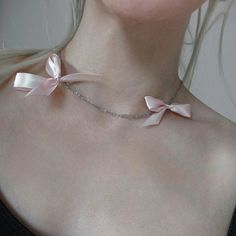 Dusty pink bow ribbon necklace on subtle silver chain for a romantic birthday or anniversary gift for a girlfriend. Light and fun summer jewelry.  𝐒𝐈𝐙𝐄: ➤ Adjustable Fits Circumference from 16″ - 20″ (40.6cm - 50.8cm)  𝐃𝐄𝐓𝐀𝐈𝐋𝐒: ➤ Materials: Stainless Steel, Ribbon ➤ Ready to Ship ---- Dusty Pink Bow Choker Necklace ---- -The Pink Bow Necklace is a delicate choker necklace featuring two dusty pink ribbon bows and double stainless steel chain design.  -Great for a fun summer day and night.  𝐇𝐎𝐖 𝐓𝐎 𝐎𝐑𝐃𝐄𝐑? 2. Add to cart 3. Select desired shipping method  𝐒𝐔𝐆𝐆𝐄𝐒𝐓𝐄𝐃 𝐂𝐀𝐑𝐄: Use water and a drop of mild detergent. Rinse, then line dry. Always make sure to wipe off water and dry your jewelry completely after cleaning. Do not use any products containing alcohol. Be Feminine Bow Necklace For Party, Delicate Bow Necklace For Party, Pink Ribbon Wedding Jewelry, Dainty Party Jewelry With Ribbon, Pink Ribbon Jewelry As Gift, Pink Ribbon Jewelry Gift, Pink Ribbon Jewelry For Gifts, Delicate Ribbon Necklace Gift, Delicate Ribbon Necklace For Gift