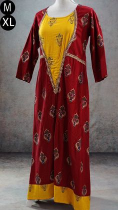 **Product color may have slight variations due to surrounding light** PRODUCT DETAILS This is a very beautiful maroon and yellow ethnic dress with gold print and Indian print throughout its body. It has gota patti detailing near its yoke and sleeves. It has three-quarter sleeves, and asymmetric hem. The Kurti has a slightly wider neck. It can be worn with a leggings or as a dress. Size & Fit Medium Chest: 38 inches Waist: 36 inches Back Shoulder: 15 inches Sleeve Length: 17 inches Armhole Round: Fitted Yellow Palazzo Set With Printed Motifs, Designer Red Cotton Silk Dress, Fitted Cotton Silk Palazzo Set With Long Sleeves, Fitted Long Sleeve Cotton Silk Palazzo Set, Traditional Long Kurta With Block Print, Wedding Kurta With Block Print For Transitional Season, Transitional Wedding Kurta With Block Print, Wedding Kurta With Block Print For Navratri, Traditional Long Kurta With Printed Motifs