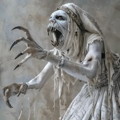 a statue of a woman dressed in white with claws on her hands and fangs out