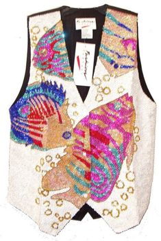 This sequin vest is handmade, high quality, original design and beautiful. Sequin vests are suitable for party, events or any occasional use. All sequin vests close with snaps in the front and the back is solid black with a strap to adjust the vest to your desired fit. Glamorous Summer Vest With Sequins, Glamorous Sequined Vest For Spring, Fitted Sequin Party Vest, Fitted Sequined Vest For Party, Fitted Sequin Vest For Parties, Sequined Fitted Vest For Spring, Fitted Sequin Vest For Spring, Sleeveless Sequined Vest For Fall, Sleeveless Fall Vest With Sequins