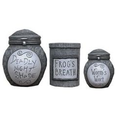 three jars with words written on them sitting next to each other