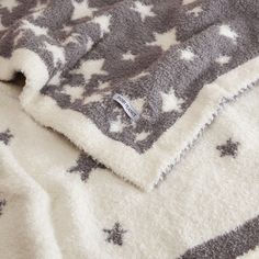 a blanket with stars is laying on the floor