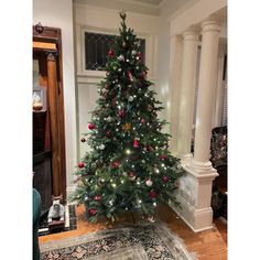 a decorated christmas tree in a living room