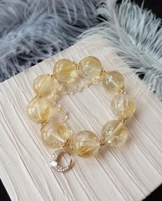 Material:Citrine Quartz beads size :Approx 21mm    quantity: one strand  6mm approx 29 pcs one strands 7mm approx25 pcs one strands 8mm approx 22 pcs one strands 9mm approx 21pcs one strands 10mm approx 19 pcs one strands 11mm approx 18pcs one strands 12mm approx 16 pcs one strands 13mm approx 16 pcs one strands 14mm approx 15 pcs one strands 15mm approx 14pcs one strands 16mm approx 14 pcs one strands 17mm approx 13pcs one strands 18mm approx 13pcs one strands 19mm approx 12pcs one strands 20mm Yellow Citrine Gemstone Bracelets, Elegant Yellow Beaded Bracelets With Gemstone Beads, Elegant Yellow Bracelets With Gemstone Beads, Elegant Yellow Gemstone Beads Bracelets, Elegant Yellow Gemstone Beaded Bracelets, Gold Citrine Round Beaded Bracelets, Elegant Yellow Beaded Bracelets For Jewelry Making, Gold Citrine Round Beads Crystal Bracelet, Gold Citrine Beaded Bracelets With Round Beads