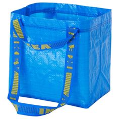 a blue shopping bag with yellow letters on the front and bottom, sitting against a white background