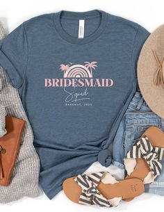 the bridesmaid t - shirt is laid out next to her shoes and purse