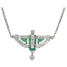 Art Deco 1915 handmade emerald and diamonds pendant necklace. Old Euro, Old Mine, Old square cut diamonds with square cut natural green emeralds set in a handmade platinum setting. 18 inches long with a later attached lobster claw. 1 old European cut diamond, G-H VS approx. .39cts 1 old mine cut diamond, G-H VS approx. .28cts 10 old square cut diamonds, G-H VS approx. 1.90cts 19 old mine cut diamonds. G-H VS approx. 1.85cts 38 square natural green emeralds, approx. .60cts Platinum 21.5 grams Cha Emerald Art Deco, Emerald Art, Art Deco Pendant Necklace, Platinum Pendant, Antique Wedding Bands, Diamond Sapphire Engagement Ring, Antique Engagement Rings Vintage, Antique Jewelry Necklace, Antique Bracelets