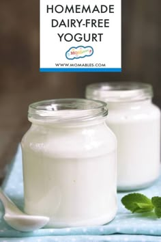 homemade dairy - free yogurt in two jars on a blue towel with mint leaves