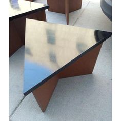 an office desk sitting on top of a sidewalk