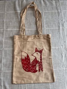 "Made To Order Fox Block Print Tote Bag Hand carved and made by me, each tote bag is unique and may vary. Each tote bag is made to order. Don't see a certain color you like? Just ask! I will be more than happy to work with you. MEASUREMENTS: Approximately 13\"x11\"  Thanks for visiting! If you have any questions, comments or are interested in commissions please don't hesitate to reach out. Follow @thesmilingoctopus on instagram!" Hand-printed Tote Bag For Daily Use, Hand Printed Tote Bag For Daily Use, Eco-friendly Hand Painted Bags For Daily Use, Hand Printed Tote Bag For Everyday Use, Hand Printed Canvas Tote Bag - Ideal Gift, Hand Printed Canvas Tote Bag For Gift, Hand Printed Canvas Tote Bag Perfect For Gifts, Hand Printed Canvas Tote Bag Ideal For Gifts, Eco-friendly Tote Bag For Crafting