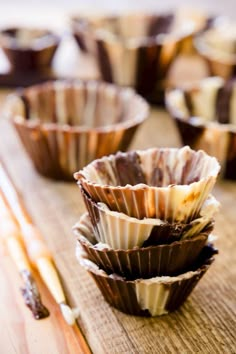 chocolate cups sitting on top of a wooden table with the words how to make a chocolate cup