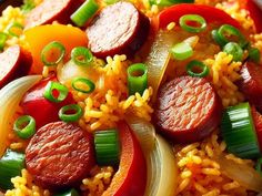 a bowl filled with rice, sausage and vegetables