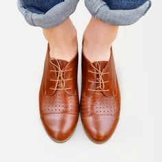 "This lace-up pair with hole-punch perforations, in a soft brown leather with seamed cap-toe, is a perfect choice for summer occasions. Slip them on to add an androgynous edge to city looks. Outer material - perforated leather, inner material - leather, closure - lace. Heel - 2.5 cm / 1.0\". --------Size Conversion & Feet Measurements-------- EU 34 US 4.0 UK 1.0 | 22.5 cm / 8.85\" EU 35 US 5.0 UK 2.0 | 23.0 cm / 9.05\" EU 36 US 6.0 UK 3.0 | 23.5 cm / 9.25\" EU 37 US 6.5 UK 4.0 | 24.5 cm / 9. Brown Shoes Aesthetic, Leather Oxfords Women, Brown Brogues, Shoes Aesthetic, Saddle Shoes, Custom Made Shoes, Oxford Boots, Shoes Custom, Brown Shoes