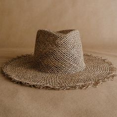 Discover the Acapulco hat: a new frayed straw hat handmade in México from seagrass. Shine at your holiday destination with this light and airy hat. The frayed edge and diamond shape of the crown give it a boho-chic touch. The elastic band on the inside provides strength and wearing comfort. Handcrafted in Mexico Ethically made from natural material Support artisanal communities Brand Partnership with Sandoval. Flat Brim Open Weave Straw Hat For Beach, Open Weave Flat Brim Straw Hat For Beach, Beach Straw Hat With Flat Brim And Open Weave, Straw Open Weave Sun Hat With Flat Brim, Open Weave Straw Sun Hat With Flat Brim, Open Weave Flat Brim Straw Sun Hat, Summer Hats With Open Weave And Flat Brim, Straw Sun Hat With Open Weave Flat Brim, Summer Flat Brim Open Weave Hat