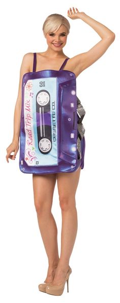 a woman wearing a costume made to look like an old school cassette tape recorder, with her hands on her hips