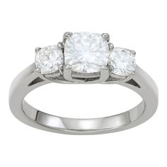 A trio of cushion-cut, lab-created moissanite gemstones give this Charles & Colvard three-stone ring a dazzlingly stylish look you'll love. A trio of cushion-cut, lab-created moissanite gemstones give this Charles & Colvard three-stone ring a dazzlingly stylish look you'll love. Width: 6.3 mm Metal: 14k white gold Plating: rhodium Finish: polished Packaging: boxedSTONE DETAILS Stone type: lab-created moissanite Total weight: 1 3/4 ct. Center stone weight: 1 1/10 ct. Center stone size: 6 3 Stone Rings, Three Stone Ring, Three Stone Rings, Three Stone, Cushion Cut, Womens Jewelry Rings, Stone Ring, Engagement Wedding, Gold Plating