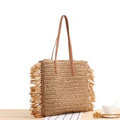 Elena Handbags Large Straw Woven Tote Bag with Tassels and Leather Strap Size: 40cm wide x 38cm tall. (16in x 15in) Designer Style ID: 8220 Large Straw Woven Tote Bag, Summer Bag, Everyday Shoulder Bag, Beach Bag Luxury Beige Jute Beach Bag, Brown Beach Bag With Tassels For Summer, Trendy Beach Straw Bag With Tassels, Summer Brown Beach Bag With Tassels, Summer Beach Bag With Tassels For Shopping, Square Shoulder Bag For Beach Season, Square Shoulder Bag For Beach Season Shopping, Summer Brown Shoulder Bag With Tassels, Bohemian Style Bags For Beach Season Shopping