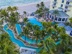 an aerial view of the pool and beach area