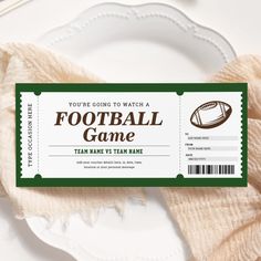 a football game ticket sitting on top of a white plate