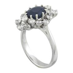 Stamped: 14K Total Ring Weight: 5.4 Grams Sapphire Weight 2.25 Carat (9.00x7.00 Millimeters)Diamond Weight: 1.00 carat (F-G Color, VS2-SI1 Clarity )Face Measures: 19.75x13.17 Millimeter SKU: [601131] Classic Cluster Ring With Round Cut Gemstone, Estate Oval Rings For Formal Occasions, Estate Style Oval Rings For Formal Occasions, Formal Oval Estate Rings, Classic Oval Sapphire Ring With Prong Setting, Classic Oval Sapphire Ring For Formal Occasions, Formal Vvs Clarity Pear-shaped Sapphire Ring, Formal Pear-shaped Sapphire Ring With Vvs Clarity, Estate Style Formal Rings With Gemstones