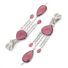 This is part of Chairish’s Fine Jewelry assortment.  Ruby Dangle earrings to make a statement with your look. These earrings create a sparkling, luxurious look featuring mixed cut gemstone. If you love to gravitate towards unique styles, this piece of jewelry is perfect for you.  PRODUCT DETAILS :-  > Material - 18K Solid white Gold > Gemstone - Ruby  > Gemstone Weight - 50.5 ct > Gemstone Shape - Mix  > Gemstone Pcs - 8 > Gemstone Size - Mix  > Diamond Weight - 4.9 ct > Diamond Size - 2.5, 1.5 Luxury Diamond Gemstone Earrings For Party, Fine Jewelry Chandelier Earrings With 17 Jewels, Fine Jewelry Chandelier Drop Earrings, Luxury Long Drop Gemstone Earrings, Luxury Gemstone Bridal Earrings For Party, Luxury Gemstone Accented Earrings For Party, Luxury Gemstone Chandelier Earrings For Formal Occasions, Elegant Gemstone Chandelier Earrings For Parties, Fine Jewelry Briolette Earrings For Evening