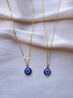 24K gold plated handmade choker necklace with a blue evil eye pendant 2 chain styles available, choose your favourite! Chain length:17 inches (~43cm) Chain length may be shortened FREE of charge, please add the length you would like in the personalisation box below upon ordering or message me! Everything comes beautifully wrapped, with a small jewellery pouch, thank you note and care instructions If this is a gift, you can also include a birthday message (and order will be sent through the letterbox) Great gifts for yourself, friends, family, partner Non-tarnish FREE STANDARD DELIVERY on all UK Orders Worldwide delivery available You can upgrade delivery options at the check out Message me if you have any questions/would like more details about anything! Check out my shop for more unique h Blue Charm Necklaces With Delicate Chain For Everyday, Blue Charm Necklace With Delicate Chain For Everyday, Blue Charm Necklace With Adjustable Chain For Everyday, Blue Dainty Chain Necklace With Delicate Chain, Dainty Blue Chain Necklace With Delicate Chain, Blue Dainty Chain Necklace, Everyday Handmade Blue Charm Necklaces, Dainty Blue Delicate Chain Necklace, Dainty Blue Charm Necklace With Adjustable Chain