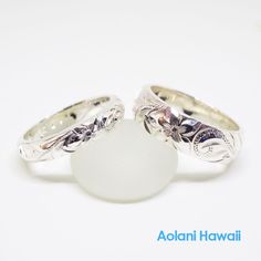 Custom order and Hand made in the Aloha StateHand engraved with Old English design - Hawaiian Maile, Plumeria, and Ocean wave.Made with sterling silver. Ring width is selectable from 4mm to 12mm, Thickness is 2mm.Picture shown above has width of 4mm and 6mm.Ring is perfect for people with an active life style, also great gift for anniversary, wedding or any special occasion. *Free inside message engraving. To make the piece more personal, you can add a special message on the inside of the ring, Traditional White Gold Engraved Ring, White Gold Etched Promise Ring, Sterling Silver Etched Jewelry For Promise, Traditional Jewelry With Engraving Option For Anniversary, Silver Couple Rings With Engraving Option For Wedding, White Carved Ring For Anniversary, Silver Oval Engraved Ring, Traditional White Gold Engraved Ring With Polished Finish, Engraved Sterling Silver Couple Rings In White Gold