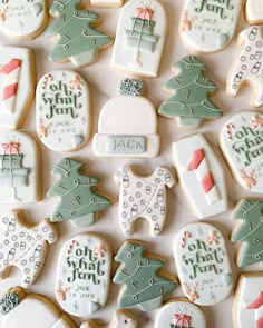 many decorated cookies are arranged on a table