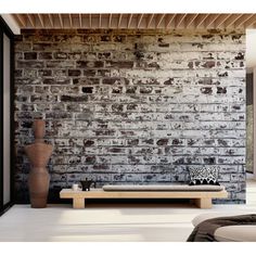 a living room with brick walls and furniture