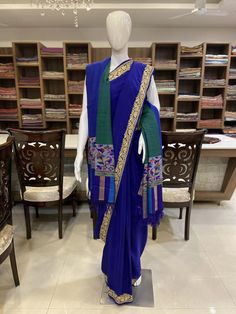 A Marvellous Embroidered Kashmiri Saree, which you can wear at any party or a wedding.- - - - - - - - - - - - - - - - - - - - Product Details- Condition: Brand New- Style: Saree- Embroidery: Kashmiri Tilla Embroidery- Base Colour: Royal Blue- Embroidery Colour: Golden - Care Instructions: Dry Clean OnlyF A B R I CSaree: Pure CrepeBlouse: Pure CrepeF I N I S H- UnstitchedYou can get it stitched locally.- StitchedWant your blouse ready to wear, let us know the style you want and we will stitch it Blue Chanderi Dresses With Cutdana, Blue Anarkali Set With Embroidered Border For Navratri, Blue Embroidered Anarkali Set For Navratri, Blue Salwar Kameez With Embroidered Border For Navratri, Designer Blue Dresses With Embroidered Border, Blue Silk Dress With Cutdana Details, Designer Raw Silk Dresses With Embroidered Border, Traditional Drape Raw Silk Anarkali Set With Embroidered Border, Traditional Raw Silk Anarkali Set With Embroidered Border