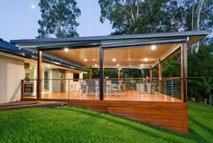 an outdoor deck and patio area in the evening