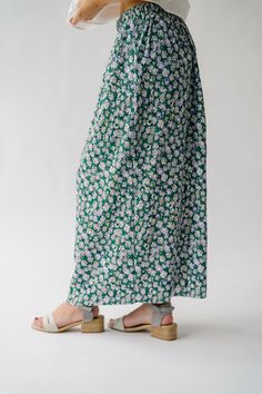 Get ready to bloom in style with the Myrick Floral Pleated Midi Skirt in Green! This flowy skirt features a beautiful floral print and elegant pleats that will add movement to your every step. Perfect for any occasion, this skirt will make you feel both playful and sophisticated. Details self/lining: 100% polyester Fabric Care Guide Here Sizing & Fit Measurements are approximate and taken while laying flat across the front. Not doubled. x-small: waist = 13"; length = 35" small: waist = 14"; leng Piper And Scoot, Pleated Midi Skirt, Flowy Skirt, Small Waist, Cardigan Jacket, Light Weight Sweater, Stripe Sweater, Sweater Vest, Try On