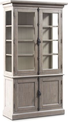 an old style china cabinet with glass doors and metal piping on the bottom shelf