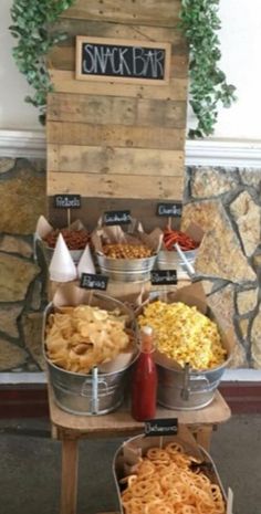 an assortment of snacks on display in buckets