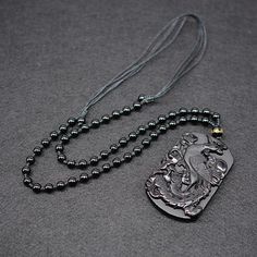 This exquisite hand-carved black obsidian pendant necklace depicts an ancient immortal Phoenix with her brood, signifying longevity, rebirth and renewal. Obsidian is said to be able cleanse negativity and encourage positive energies. Combined with the mystical Phoenix, this necklace is a meaningful gift for any loved one. Material: Natural Black Obsidian, Waxed Cord Chain, Beads Pendant Size: 6.5 x 4.2 x 1.0 cm (2.3" x 1.5" x 0.4") Necklace Length: 60 - 72cm (23.6" - 27.6") Adjustable Cord Click ADD TO CART To Order Yours Now! The Checkout Process is Guaranteed to be 100% Safe and Secure with Visa, Mastercard, AMex, Discover, Apple Pay or PayPal. Black Obsidian Amulet Necklaces, Black Obsidian Amulet Necklace, Black Obsidian Necklaces For Meditation, Black Obsidian Necklace For Meditation, Black Amulet Jewelry For Meditation, Black Obsidian Pendant Jewelry, Black Obsidian Necklace For Healing, Obsidian Pendant Amulet Necklace, Obsidian Amulet Pendant Necklace