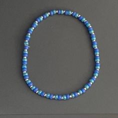 This is a dainty beaded bracelet, made of 3mm glass seed beads in the shades turquoise and deep periwinkle and 2mm glass seed beads in the shade metallic silver.  The bracelet is stretchy (no clasp) with an approximate circumference of 7 inches.  Thanks for visiting my shop. Please message me if you have any questions! Turquoise Beaded Bracelets With Spacer Beads For Everyday, Turquoise Beaded Bracelet With Spacer Beads, Blue Tiny Beads Friendship Bracelets, Blue Heishi Beads Bracelets With Spacer Beads, Blue Beaded Bracelets With Tiny Beads For Everyday, Blue Minimalist Beaded Bracelets As Gift, Minimalist Blue Beaded Bracelets As Gift, Minimalist Blue Beaded Bracelet As Gift, Blue Jewelry With Tiny Beads For Everyday