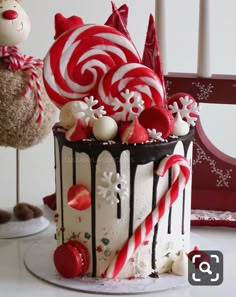 a christmas cake decorated with candy canes and candies