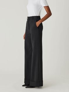 Featuring a high waist, sophisticated wide-leg silhouette, and chic cuff details, these trousers offer a polished and elegant look. High waist Wide-leg silhouette Chic cuff details 41% Wool, 52% Polyester, 4% Elastane, 3% Polyamide Dry Clean Only Luxury Wide Leg Pants With Belt Loops, Chic Black Wide Leg Pants With Pressed Crease, Formal Wide Leg Pants With Belt Loops, Modern Structured Bottoms For Formal Occasions, Modern Structured Formal Bottoms, Tailored Structured Bottoms For Evening, Modern Structured Office Bottoms, Luxury Wide Leg Dress Pants, Chic Structured Bottoms With Pressed Crease